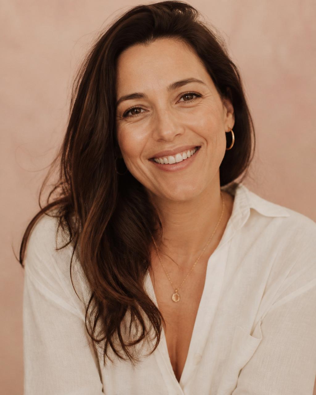 A woman with a warm genuine smile