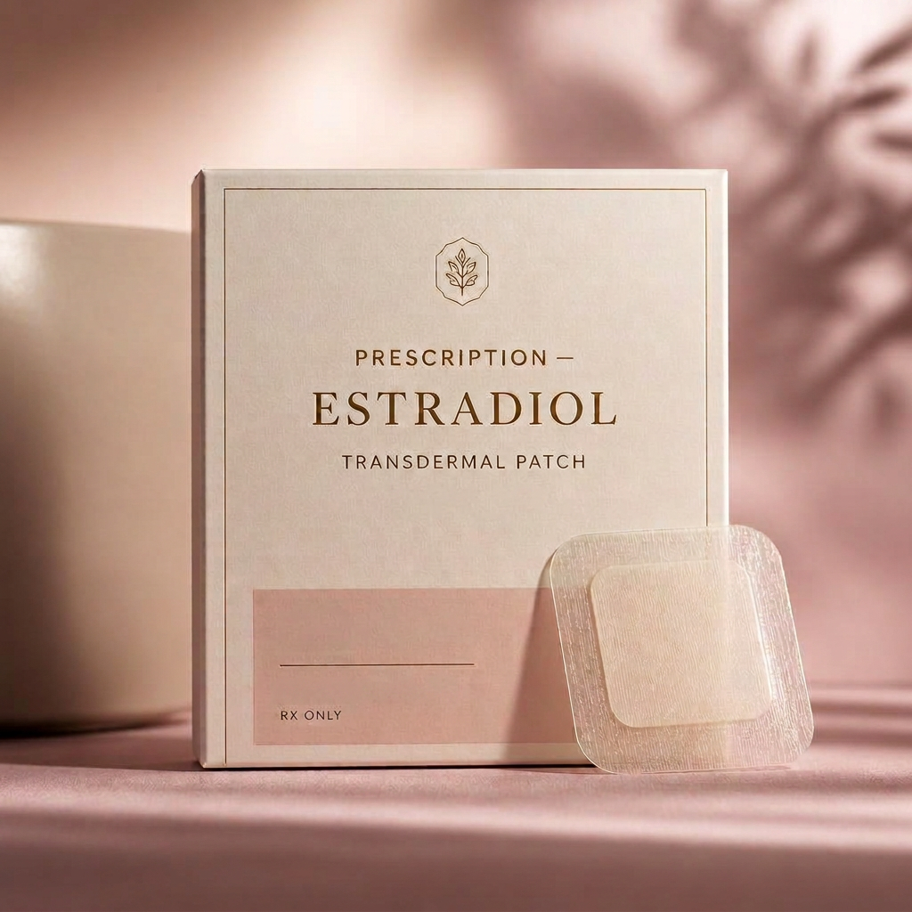 Prescription Estradiol transdermal patch and packaging on a soft blush studio background