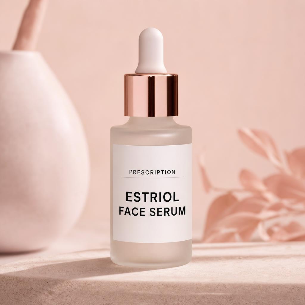 Prescription Estriol Face Serum dropper bottle on a soft blush studio background